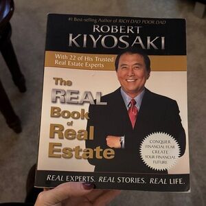 Robert Kiyosaki The Real Book of Real Estate - Black, Gold & Cream Cover